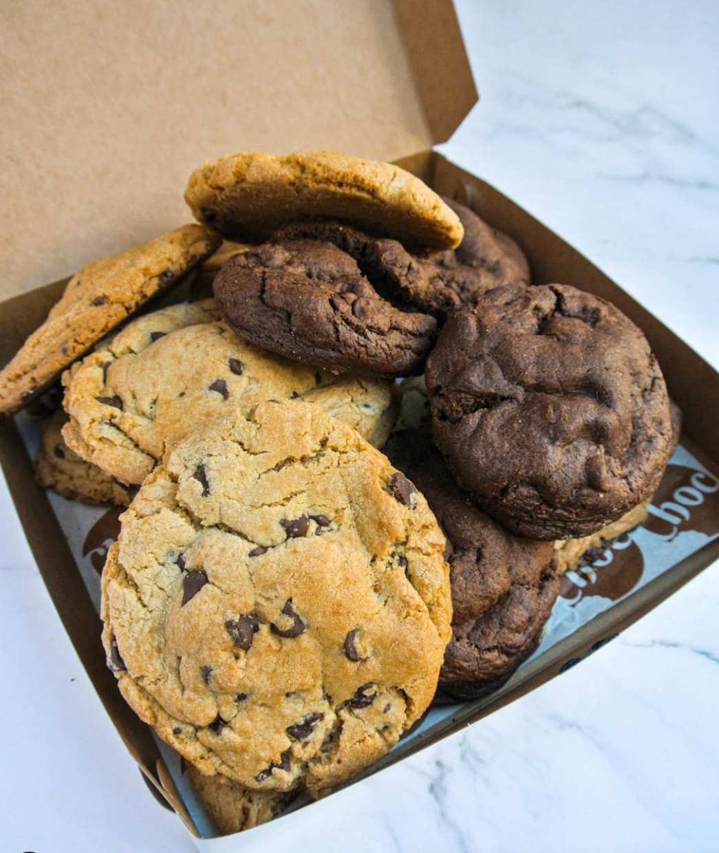 A box piled high with giant Choc Cookies